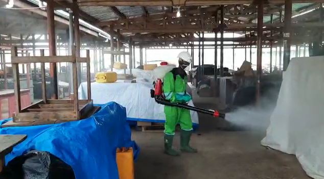 Spraying markets in Ghana